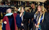 There were happy moments as WHC Chancellor Kristen Clark gives high fives to students while walking out of the Golden Eagle Arena.